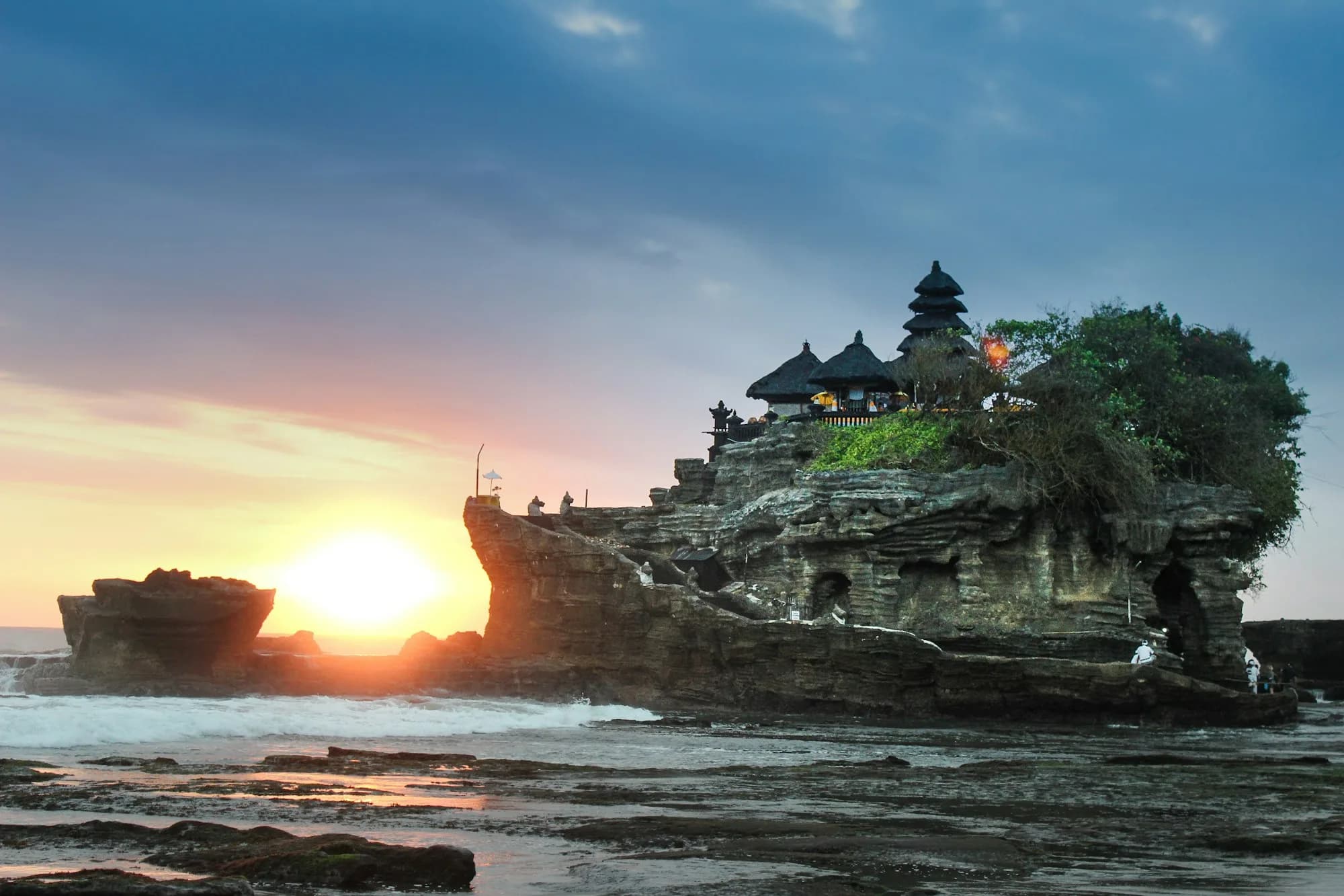 Traditional Balinese temple gate framed by tropical forest